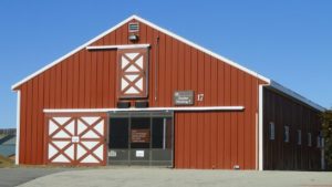 A modern red horse barn