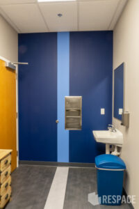 Restroom with blue striped wall